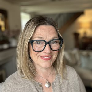 Lucy, smiling at camera