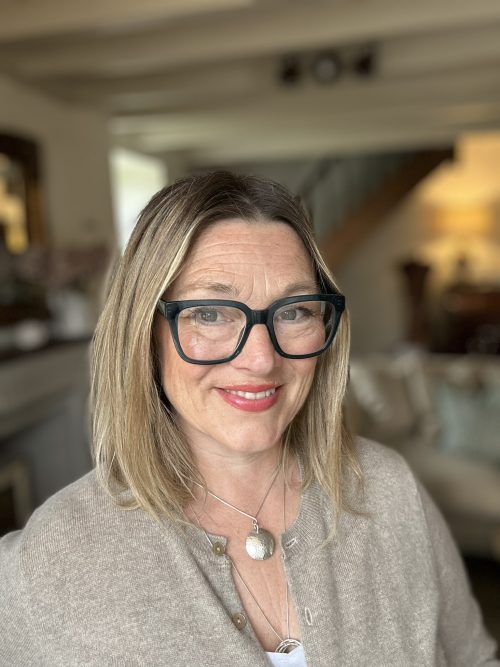 Lucy, smiling at camera