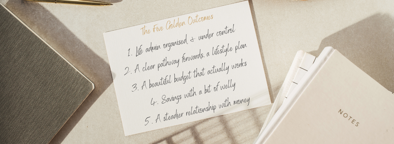 Notecard on desk with The 5 Golden Outcomes handwritten