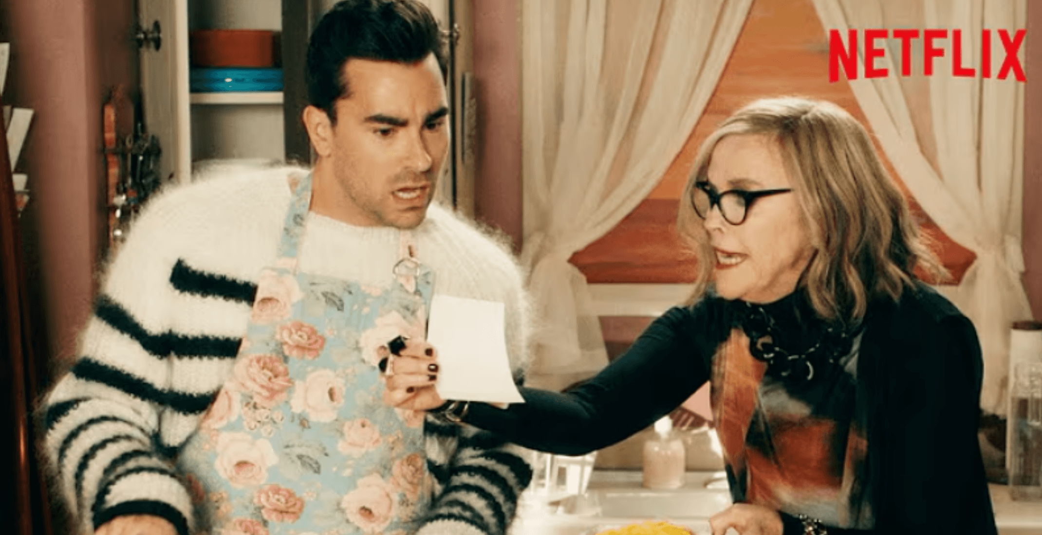 Schitts Creek scene with David and Moira in the kitchen